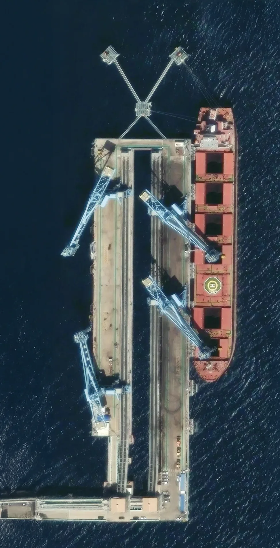 Aerial view of Hosan Port and berthed vessel